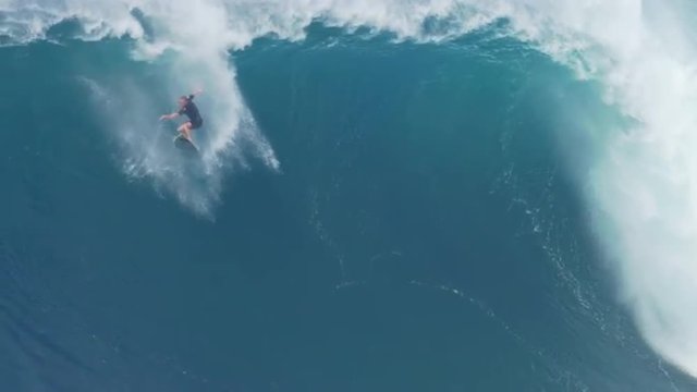 MAUI, HAWAII.  January, 15 2016: Big Wave Surfing. Surfers Ride Giant Ocean Waves at Jaws. EDITORIAL USE