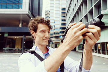 Male photographer taking picture