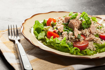 Tasty salad with couscous, tuna and vegetables