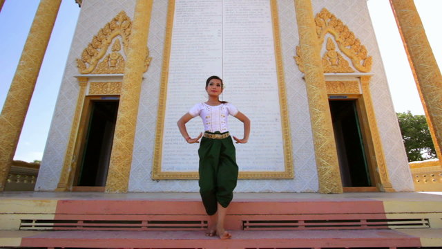 Beautiful Asian Girl performs cambodian folk dance in temple