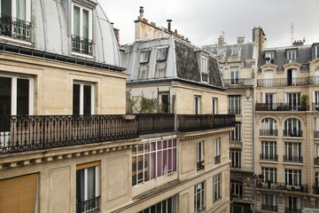 Fototapeta na wymiar The upper floors of a residential building in Paris