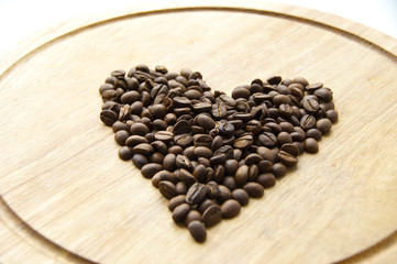 Coffee beans on a wooden board