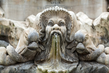 Fototapeta na wymiar Close up of Fountain of the Pantheon (Fontana del Pantheon) at Piazza della Rotonda .. Rome, Italy