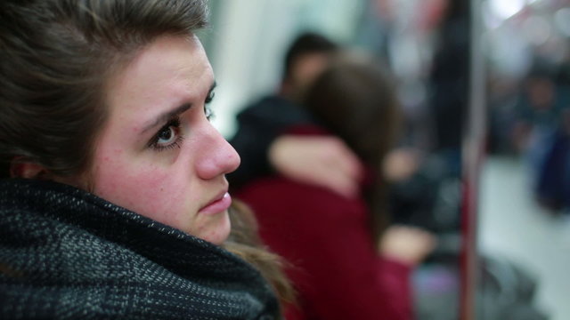 Lonely Woman travelling with metro