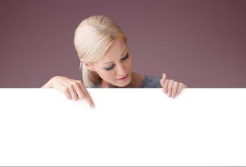 Woman with blank signboard