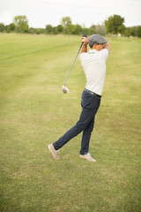 Young man playing golf