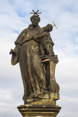 Fototapeta na wymiar Statue of St. Anthony of Padua on Charles Bridge in Prague
