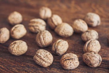 Walnuts on wooden background