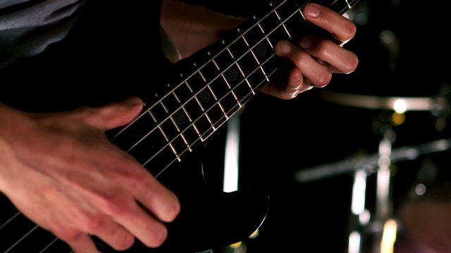 Close up of man playing the bass