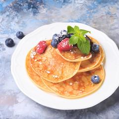 Pancakes with berries and mint