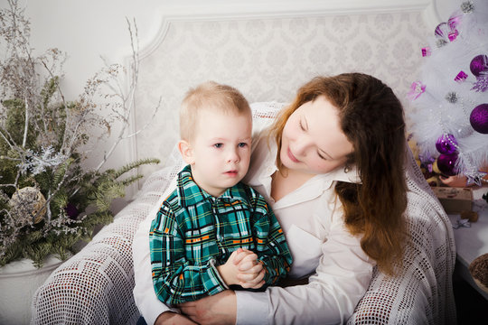 Portrait Of Mother And Her Little Sad Son