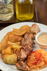 Grilled pork, baked potatoes