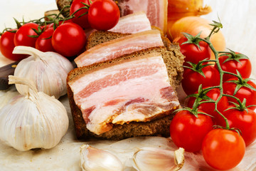 Of salted bacon sandwiches on rye bread.