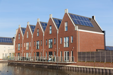 Fototapeta na wymiar New family homes with solar panels on the roof