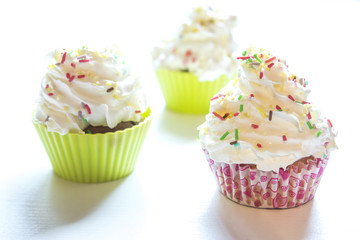 Sweet cupcakes on a white background