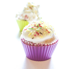 Sweet cupcakes on a white background