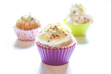 Sweet cupcakes on a white background