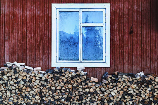 vintage country home window and firewood under