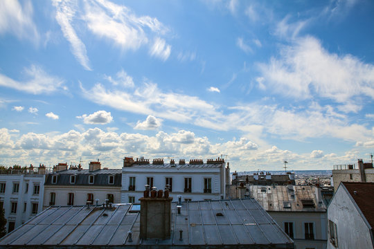 Fototapeta View from Montmartre to summer Paris and beautiful blue sky with soft clouds.