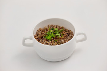 Bowl of fresh diet buckwheat porridge isolated 