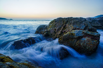  waves breaking on the rocky beach.