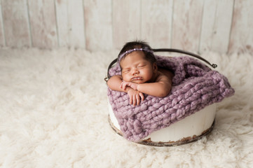 Newborn Girl Sleeping in Wooden Bucket