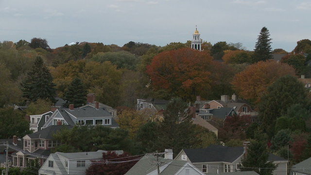 Church spire above fall foliage in Marblehead.