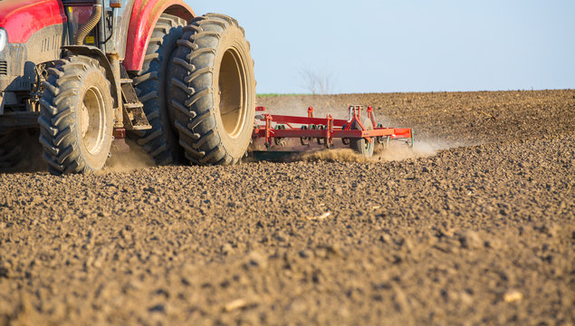 Close up shot of seedbed cultivator machine at work