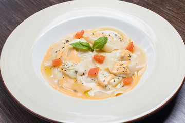 Tasty ravioli with parmesan