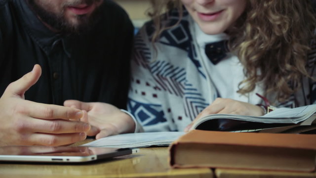 close up couple of students studying slow motion in university