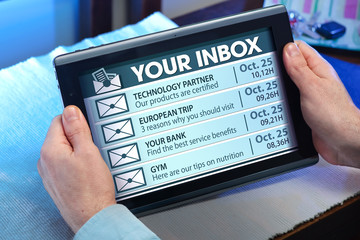 hands of a man looking emails in tablet / man with tablet which see your mail in inbox 