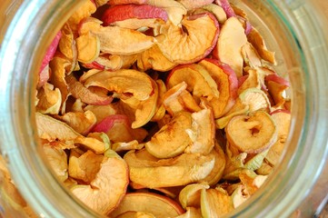 dried apples in a glass jar. top view down