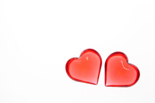 Couple of red glass hearts on white background. Valentine's day. Valentines