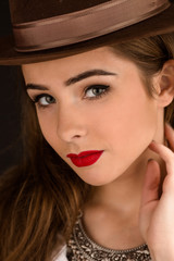 Beautiful model lady in hat in studio