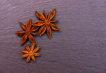 Star anise on slate top seen from above
