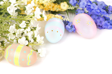 Colorful Easter Eggs and Flowers on a White Background