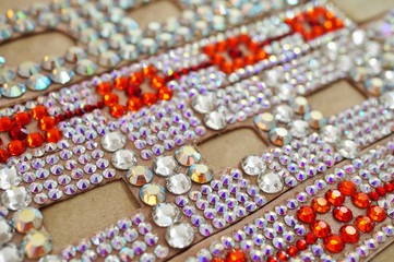 Ballroom dancing competition jewelry made of shiny crystals glued on fabric