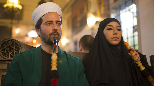 Portrait of islamic couple, smoking shisha