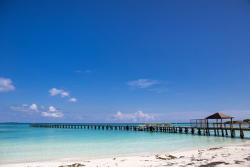 Wooden pier on tropical beach