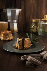Close-up of cake with dark chocolate pouring