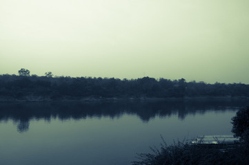 sunset over Mekong river, fisherman boat
