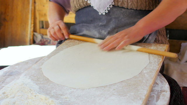 woman preparing traditional food, gozleme, safranbolu, turkey
