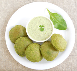 Indian food palak or spinach poori is a vegetarian dish made from the dough of palak puree and wheat flour.
