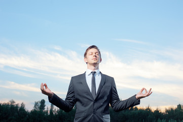 Businessman meditating