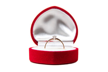 Gold ring with diamond in red box - heart, isolated on a white