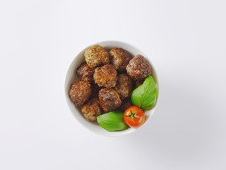 bowl of pan fried meatballs