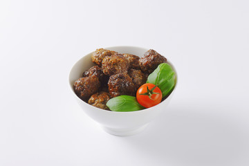 bowl of pan fried meatballs