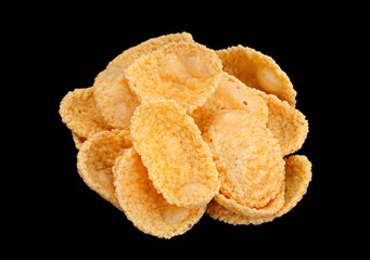 Corn flakes snack on black background