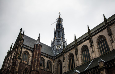 Fototapeta na wymiar NETHERLANDS, HAARLEM - OCTOBER 26, 2015: Big ancient church in Haarlem. Holland.