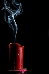  gray smoke from the red candle that went out